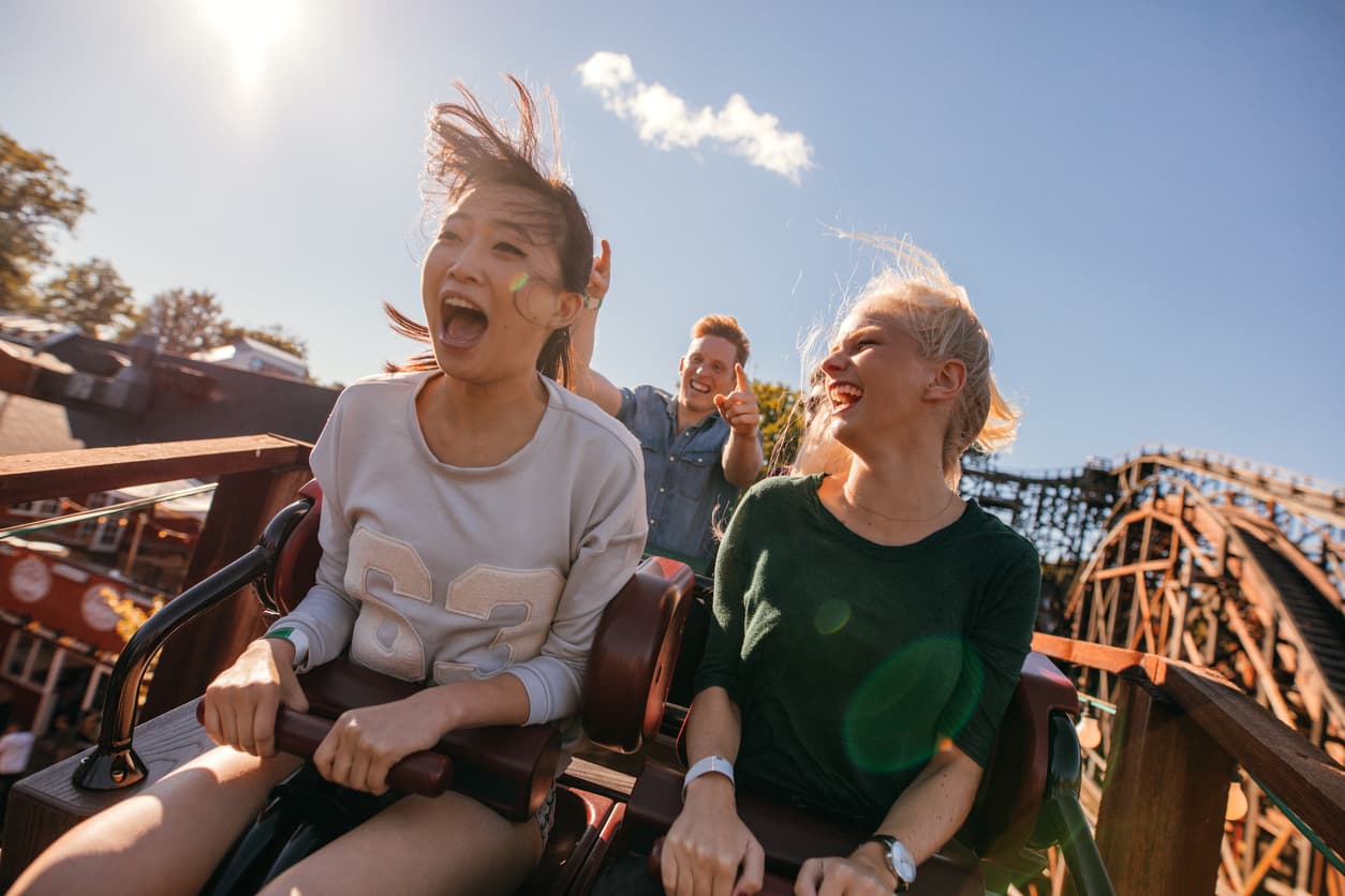 People riding a rollercoaster at an amusement park