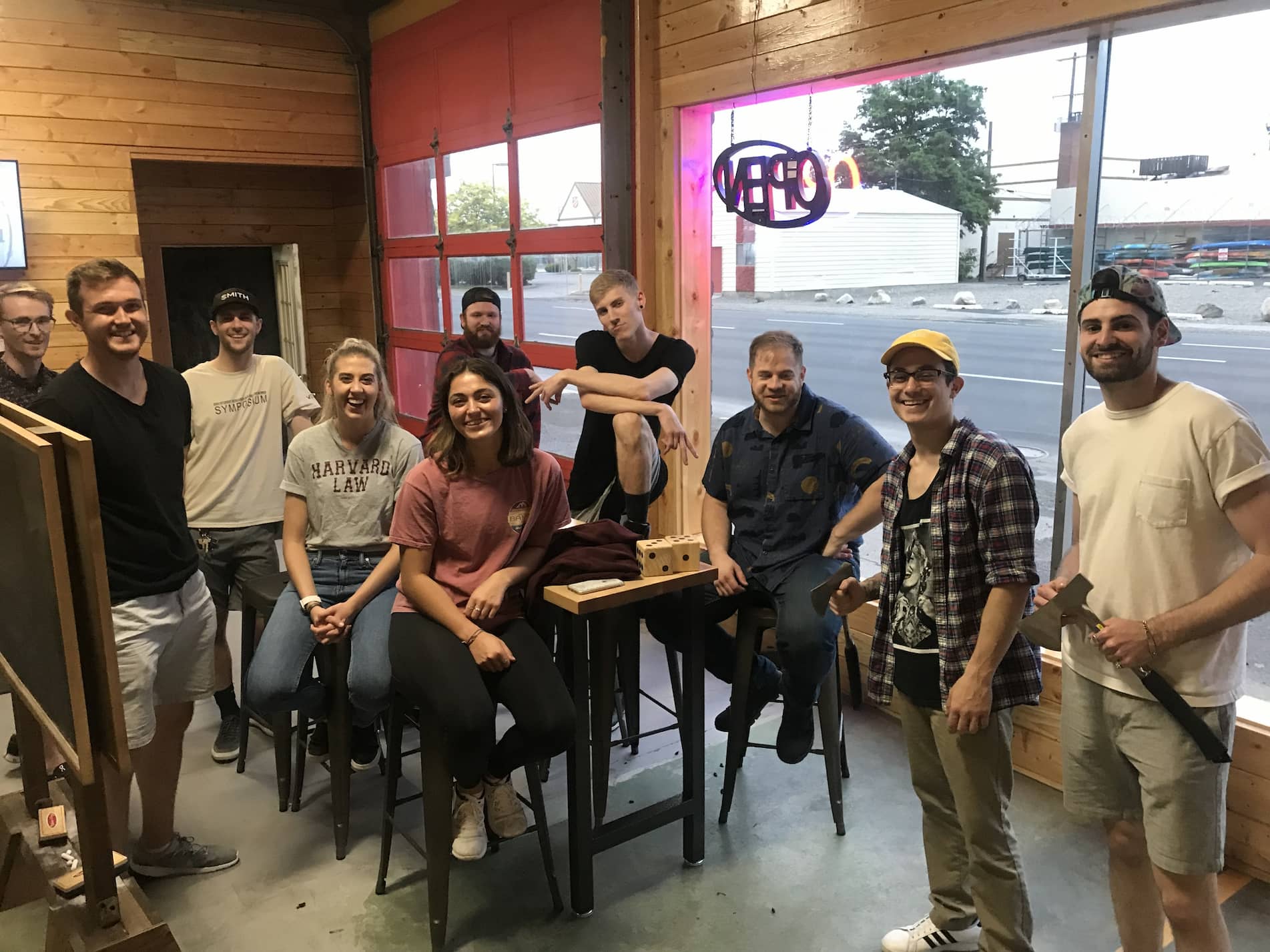 a group of coworkers during an axe throwing activity in Spokane